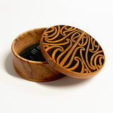 Round Rimu Box with Puhoro Maori Carving