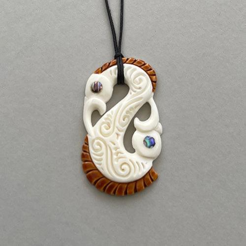 HAND CARVED NATURAL STAINED BONE MANAIA WITH HOOK PENDANT ONE ONLY ART – NZ  Pacific